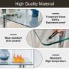 Modern minimalist glass dining table. A transparent tempered glass desktop with a thickness of 0.3 feet and metal legs. Suitable for restaurants and l