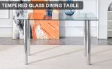 Modern minimalist glass dining table. A transparent tempered glass desktop with a thickness of 0.3 feet and metal legs. Suitable for restaurants and l