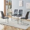 Modern minimalist glass dining table. A transparent tempered glass desktop with a thickness of 0.3 feet and metal legs. Suitable for restaurants and l